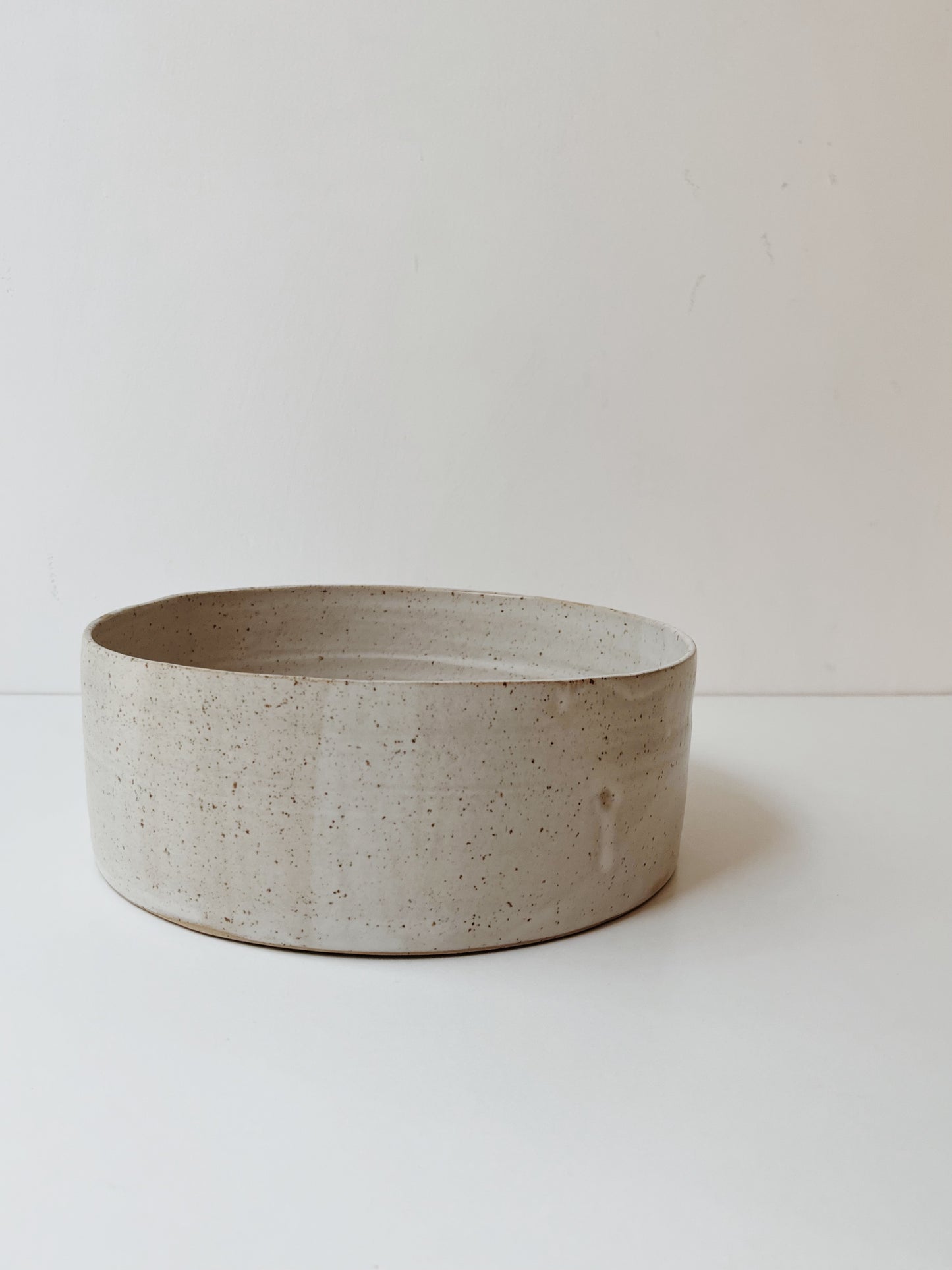 Speckled ceramic serving bowl